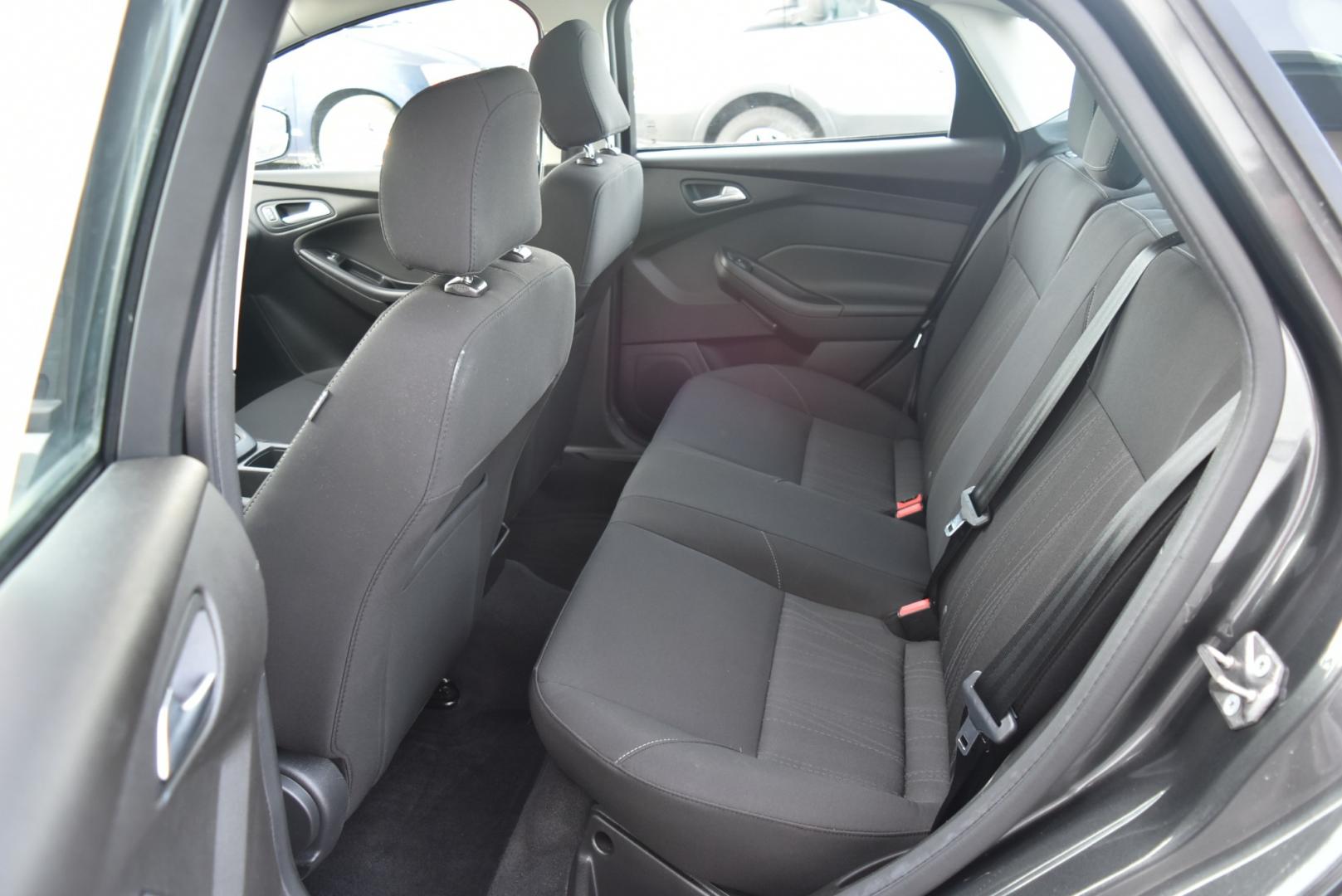2016 Gray /Black Ford Focus SE (1FADP3F26GL) with an 2.0L I-4 GDI TI-VCT FLEX FUEL engine, 6-Speed Powershift Automatic transmission, located at 1600 E Hwy 44, Rapid City, SD, 57703, (605) 716-7878, 44.070232, -103.171410 - Photo#11
